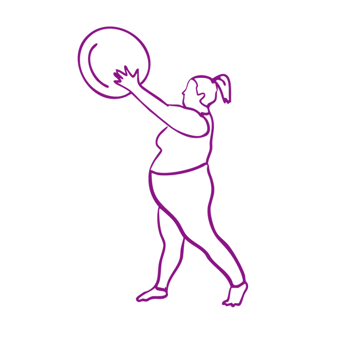 a mid sized person exercising holding a giant ball up to the right