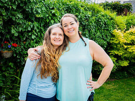 leanne and Kerry arm in arm in a garden