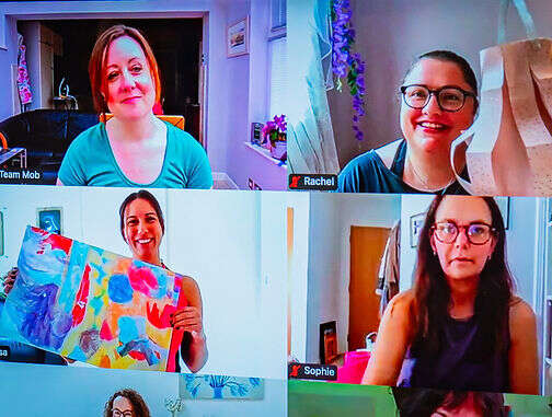 mobilates members on a TV screen taking part in a class