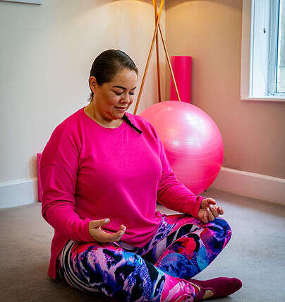 Leanne, retreat facilitator and movement instructor, smiling