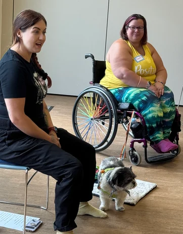 Mobilates members at a retreat, including a wheelchair user.