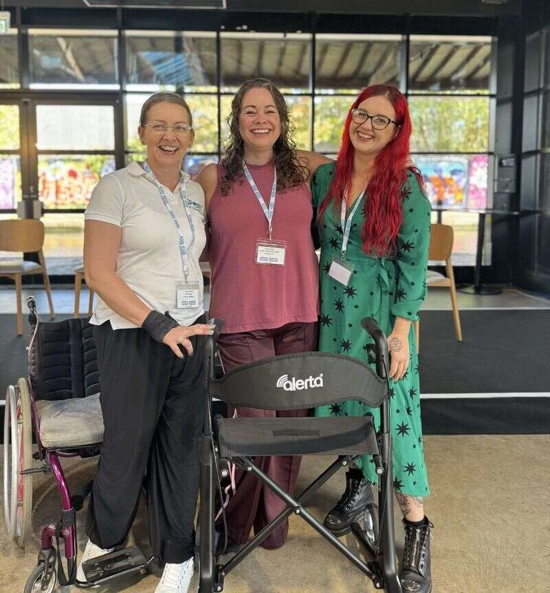 Leanne, Suzanne and a colleague smiling together at the Include to Improve conference in Birmingham